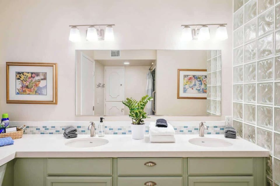 Spacious bathroom with two vanities.