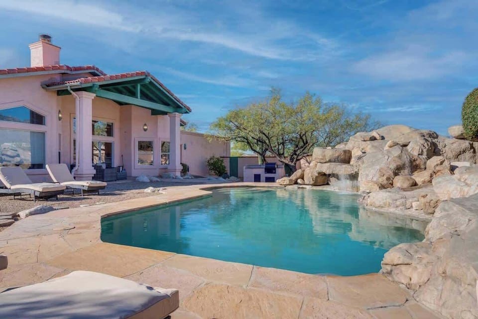 Sparkling pool with lounge chairs.