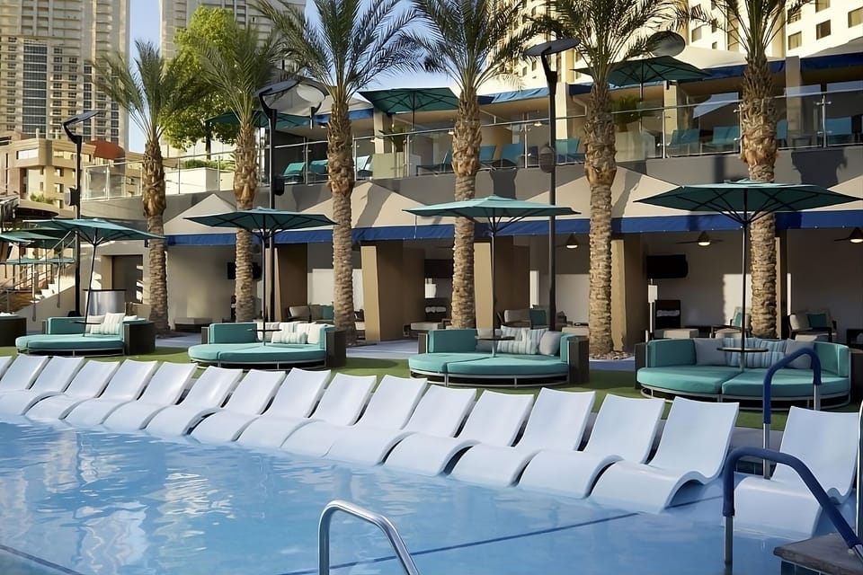 Soak up sunshine on chic loungers beside the sparkling pool.