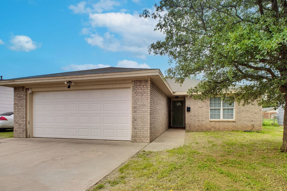 Property Exterior | Covered Patio | Fenced-In Yard