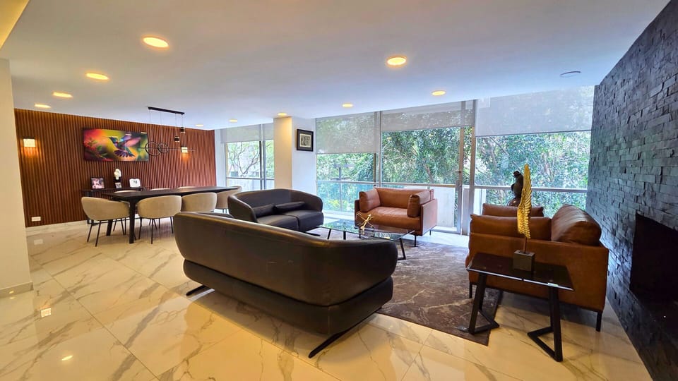 Bright modern lounge with floor-to-ceiling windows and stylish seating