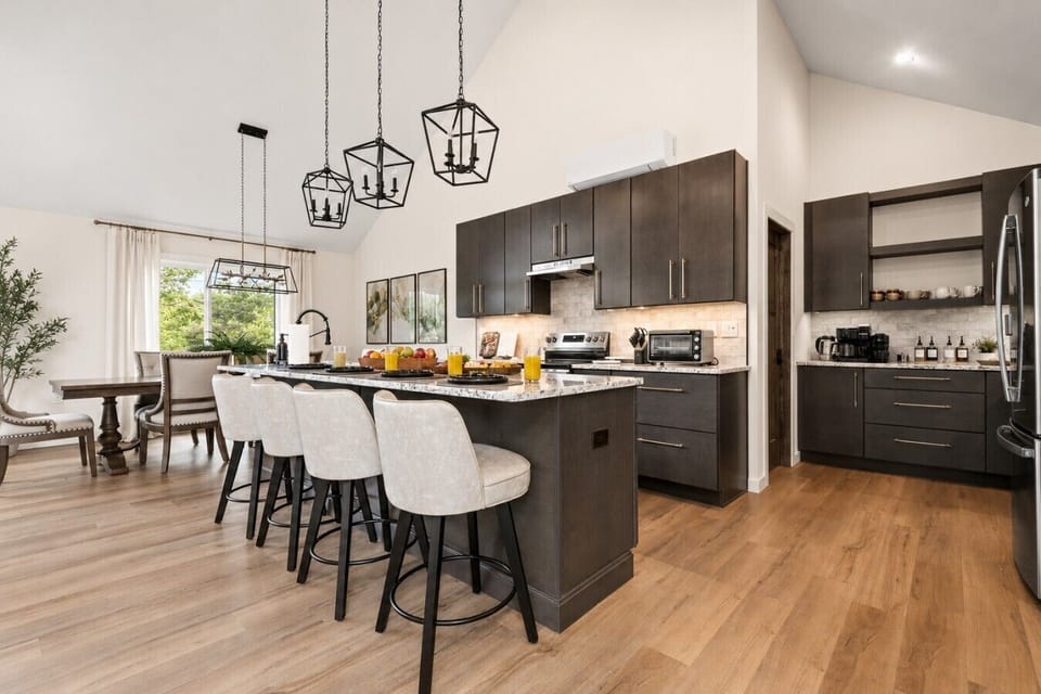 Pull up a seat! The kitchen island offers four additional seats for coffee, conversation, and casual dining.