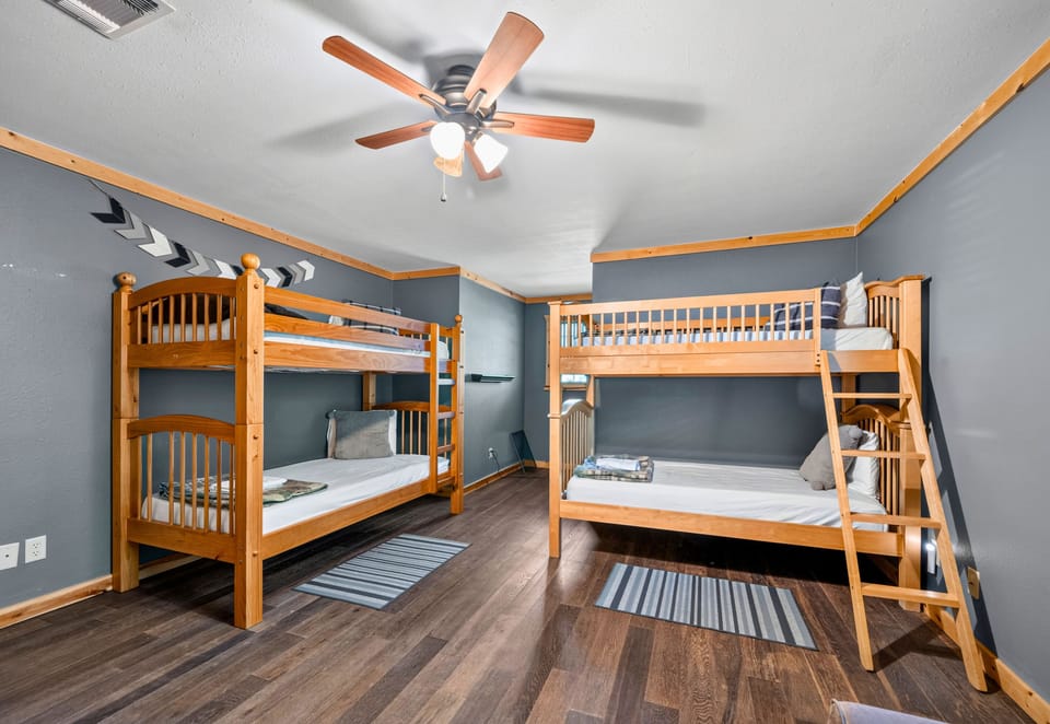 With comfortable sleeping arrangements and extra floor space, the bunk room is perfect for siblings, cousins, or friends traveling together.