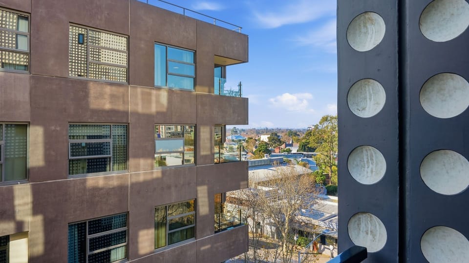 Enjoy glimpses of the surrounding neighbourhood from your elevated apartment setting.