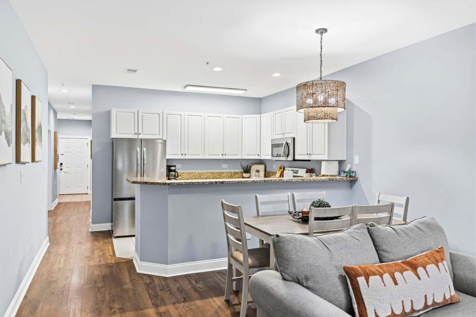 Enjoy a seamless, airy flow between the kitchen, dining, and living areas—perfect for entertaining and keeping everyone connected after a day on the course.