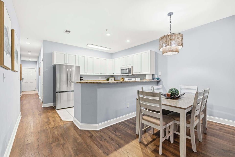 Gather together for a home-cooked breakfast or a late-night dinner at a spacious dining table right next to a fully equipped kitchen.