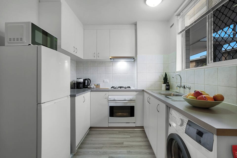 Fully equipped kitchen with modern appliances for easy home-cooked meals.