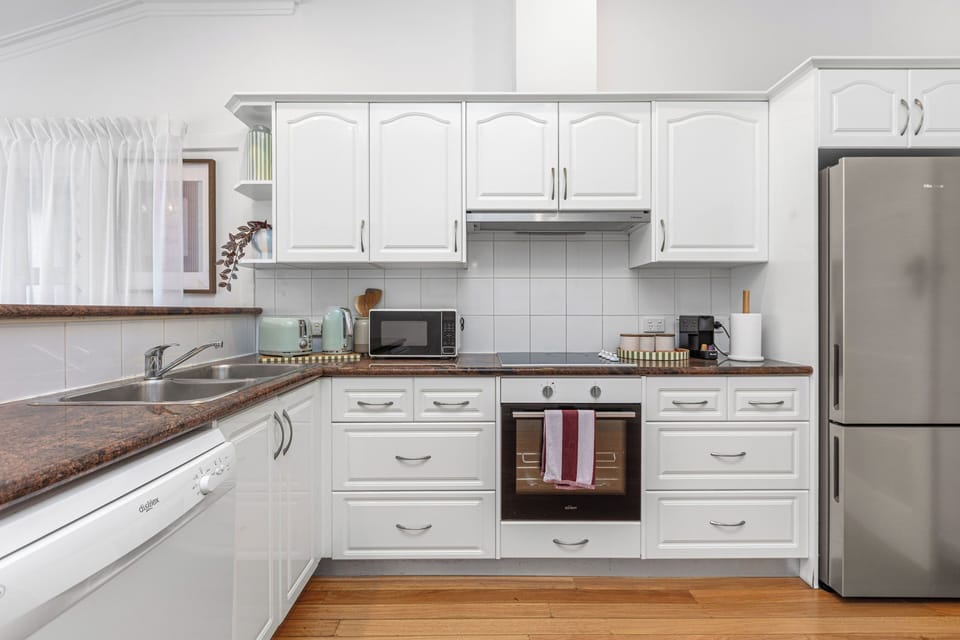 A spacious, well-organized cooking space designed with all the essentials you need for a comfortable stay.
