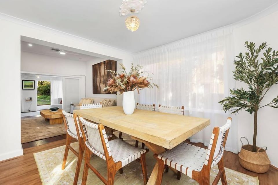 Bright dining area with a view through to the living room.