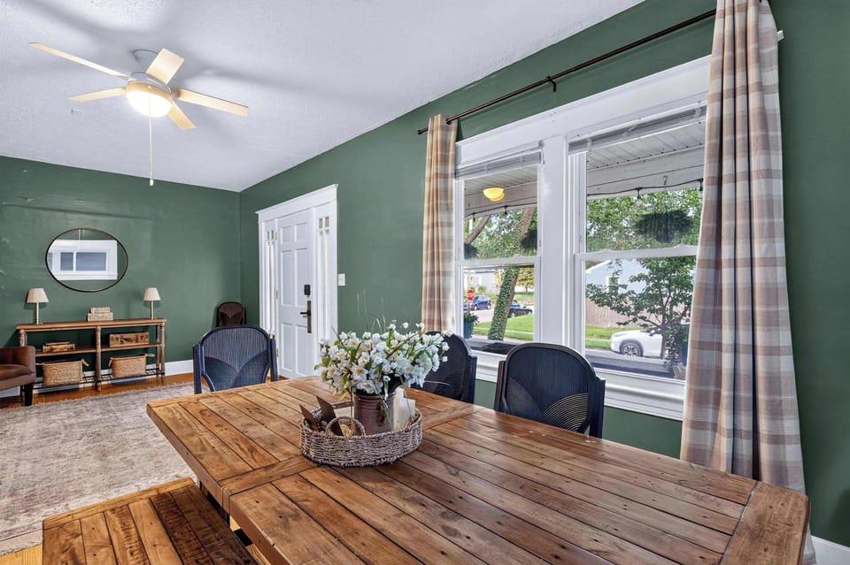 Dining Area: Gather around the inviting dining area, featuring a spacious table and comfortable seating for shared meals, morning coffee, family conversations, or planning the day ahead.