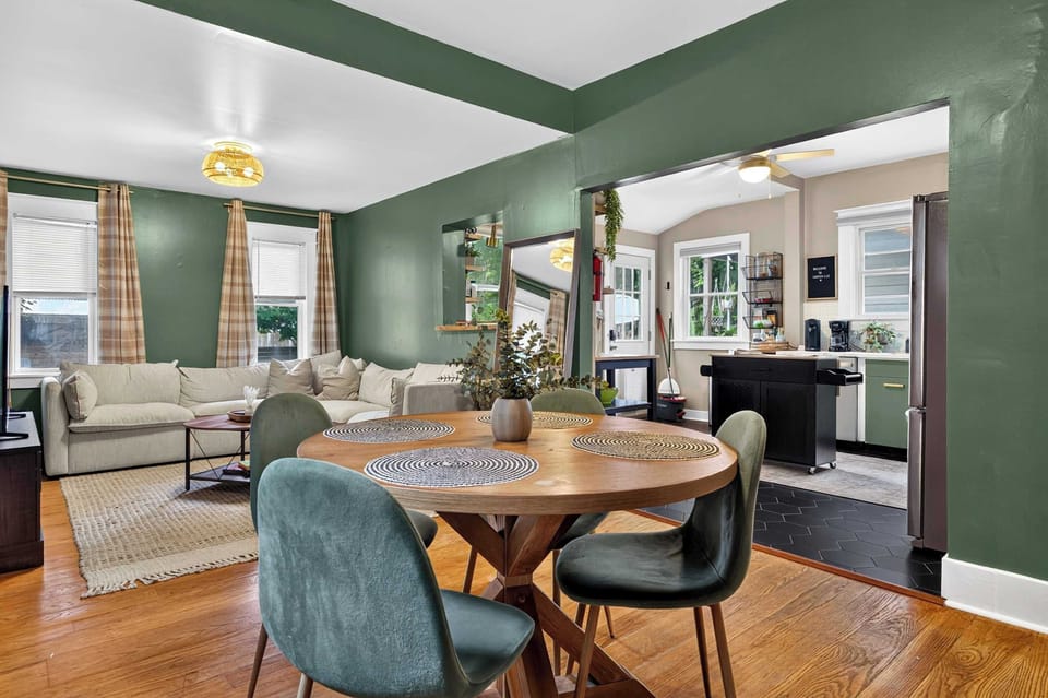 Dining Area: Gather around the inviting dining area, featuring a spacious table and comfortable seating for shared meals, morning coffee, family conversations, or planning the day ahead.