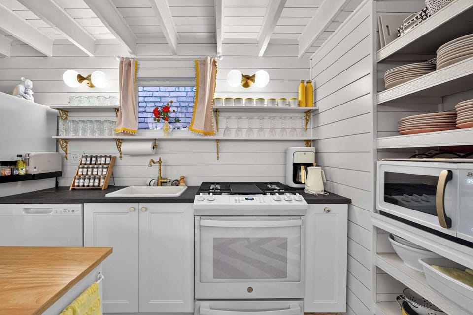 Kitchen: Enjoy a bright and colorful kitchen designed for both style and function, complete with modern appliances, cookware, and spacious countertops.
