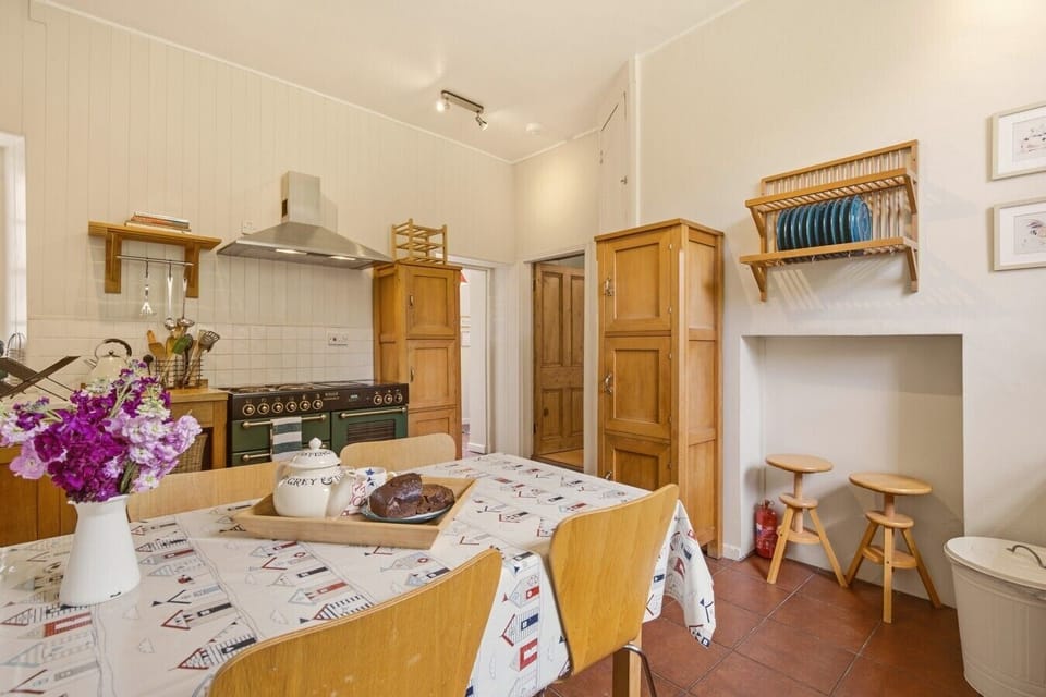 Traditional country kitchen with dining table and charming breakfast nook