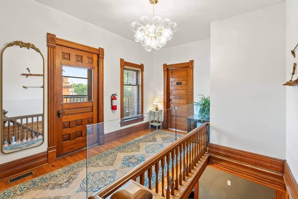 The second floor is your private retreat, home to three ensuite bedrooms, the Pearl Parlor lounge, and a balcony with a fire table—the perfect place to gather after a day exploring Kingsville.