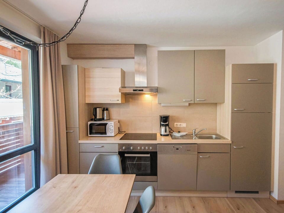 Kitchen, Countertop, Kitchen Appliance, Furniture, Major Appliance, Cabinetry, Interior Design, Wood, Sink, Flooring