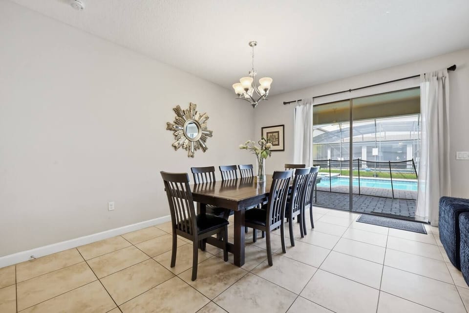 Bright dining space for 6 with pool views and easy patio access