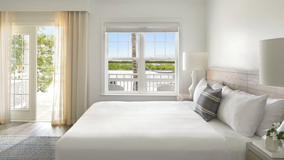 Wake to breezy balcony light and serene coastal views.