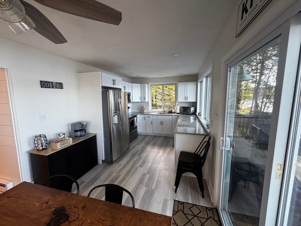 Bright kitchen with full amenities and a cozy coffee bar — enjoy your morning!