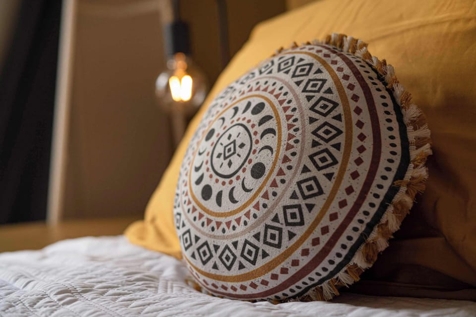 Warm lighting and stylish details create a cosy atmosphere for restful nights.