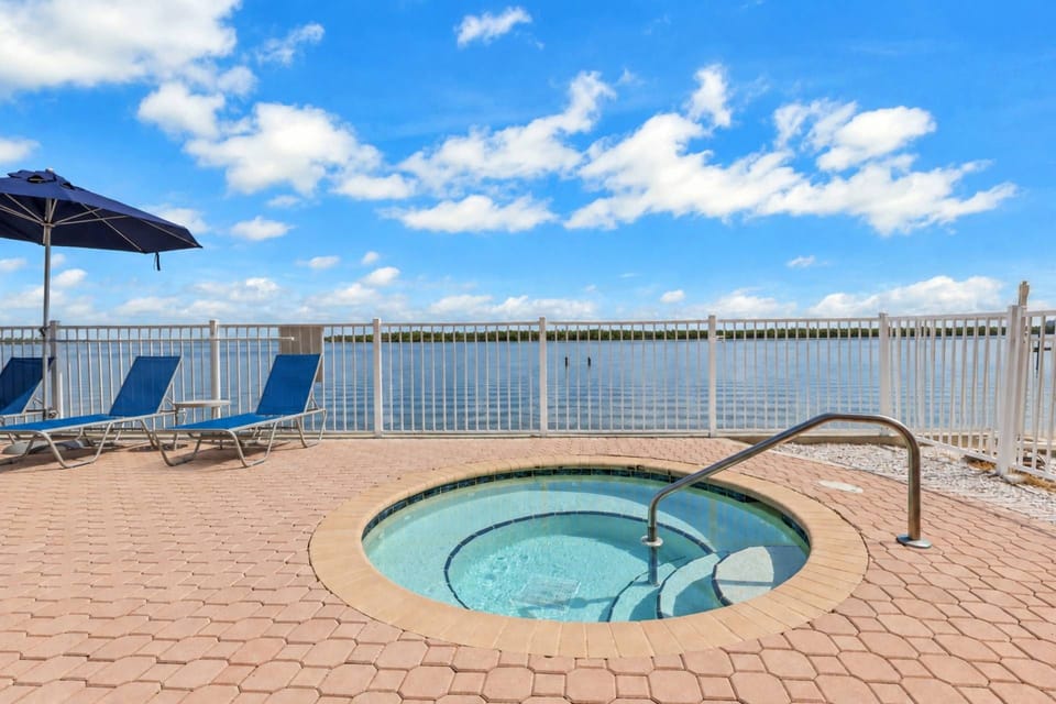 Soak, unwind, and take in the view from the bayfront hot tub, adjacent to the lagoon pool.