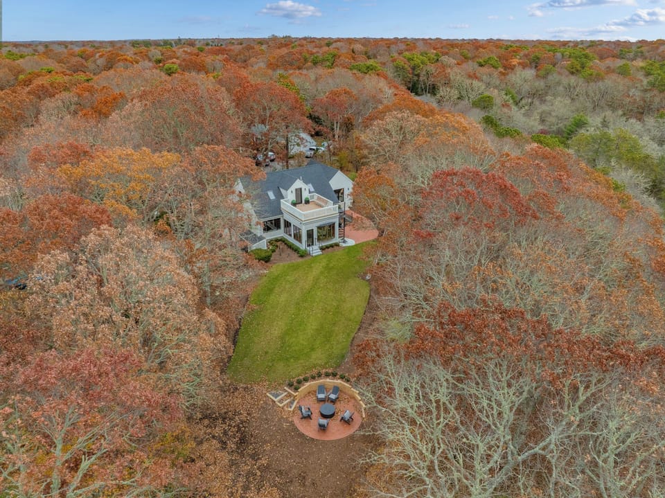 Private woodland retreat with spacious lawn and cozy fire pit area