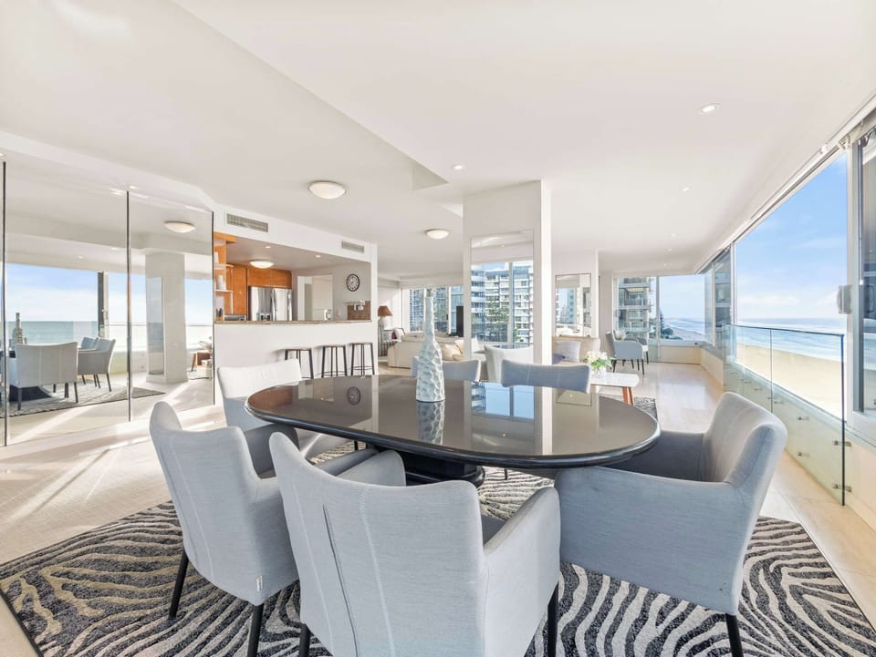 The dining table, the ocean the length of the glass.