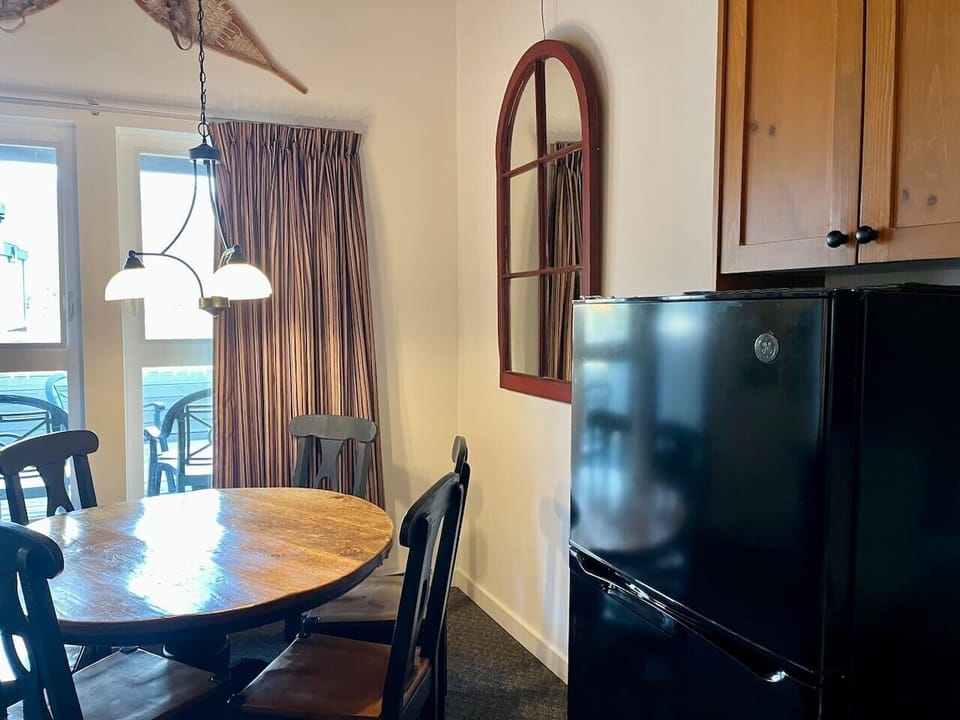 Full kitchen with dining table.
