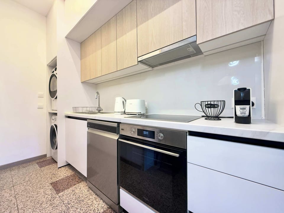 A fully equipped modern kitchen with everything you need to prepare breakfast, lunch, or dinner during your stay.