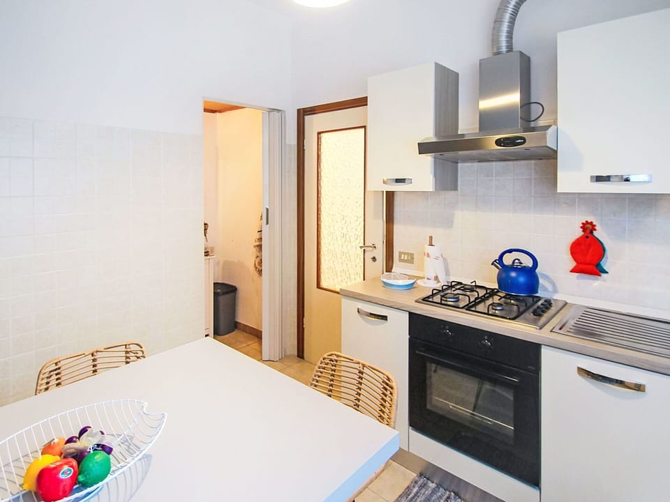 Interior Design, Flooring, Kitchen, Wood, Floor, Kitchen Appliance, Major Appliance, Furniture, Countertop, Room