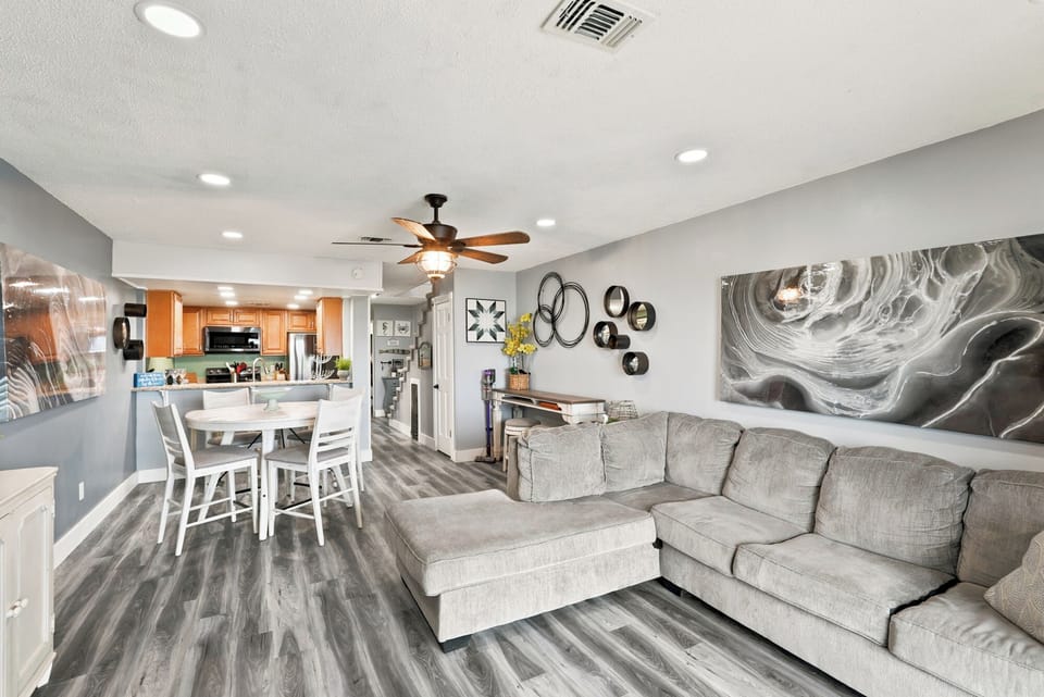 Settle into your modern retreat where a plush sectional and open-concept living create the perfect space to unwind. The fully equipped kitchen invites you to prepare meals while enjoying the seamless flow of this stylish, comfortable home.