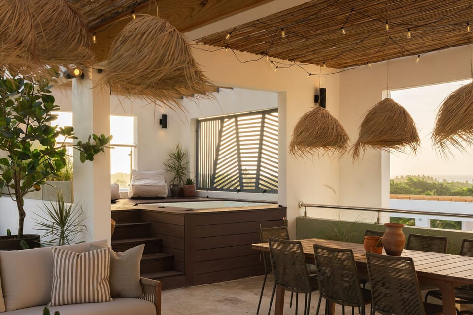 Jacuzzi with built-in deck seating and ocean views — a refreshing afternoon dip