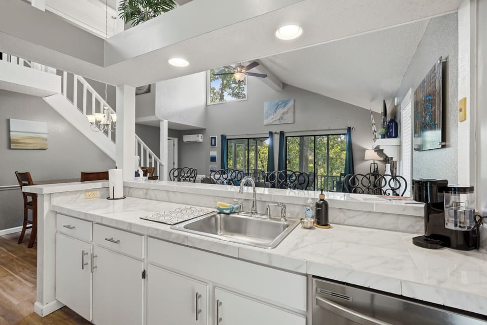 Bright open kitchen with vaulted ceilings and airy loft-style living space