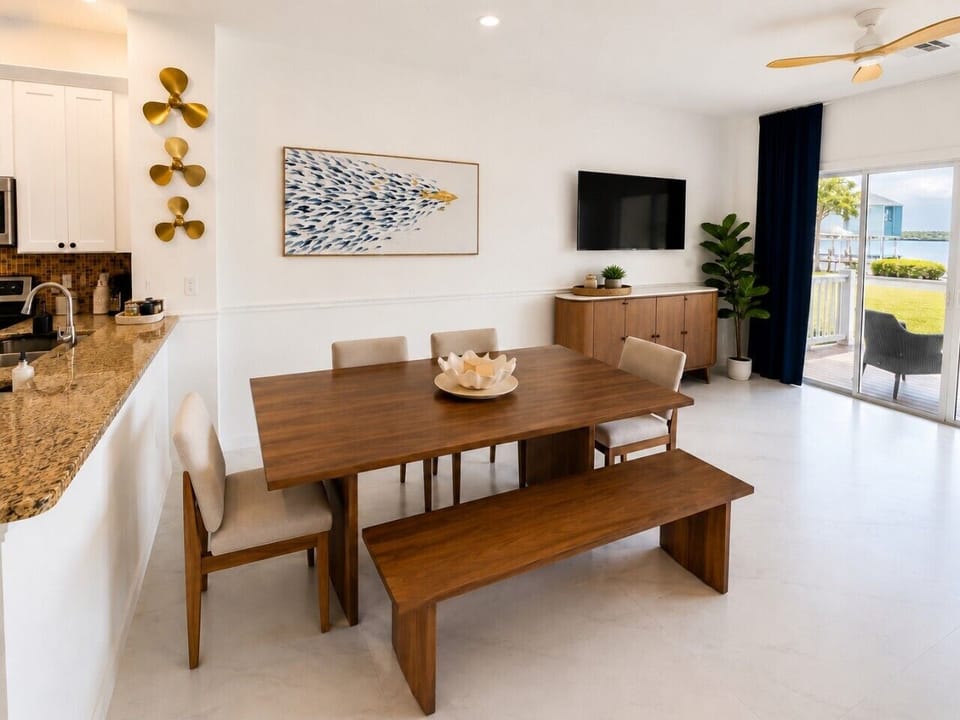 Gather around the dining table for family meals while enjoying an open-concept layout and waterfront views.