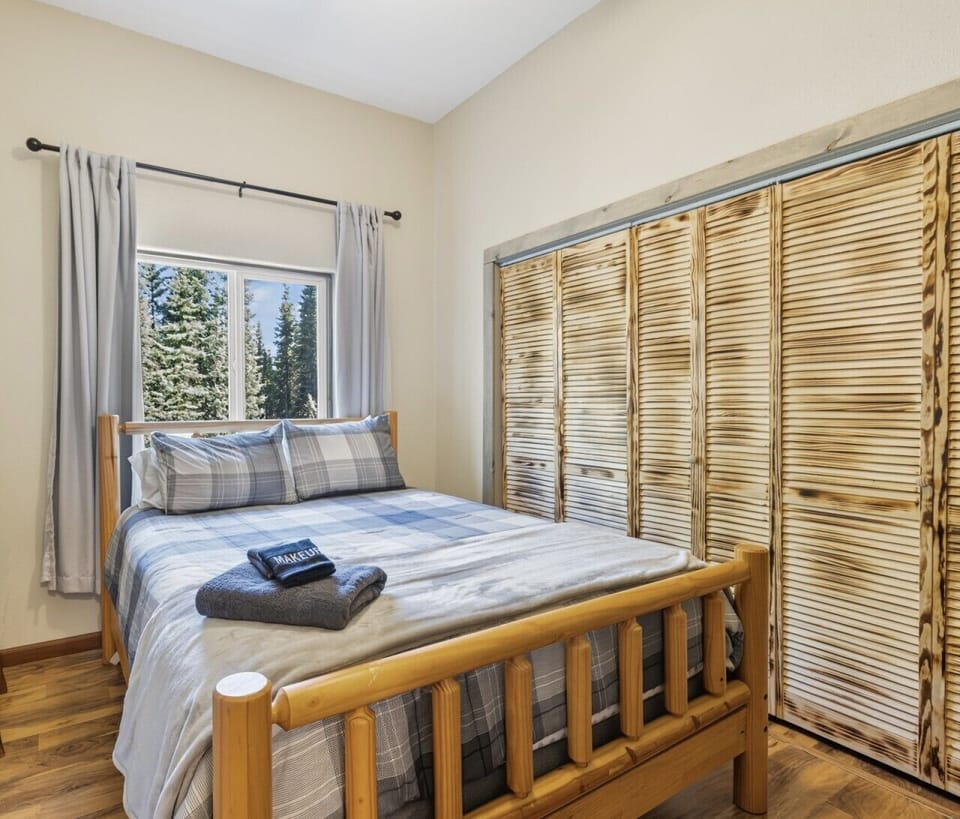 The cabin`s second bedroom with another cozy queen size bed.