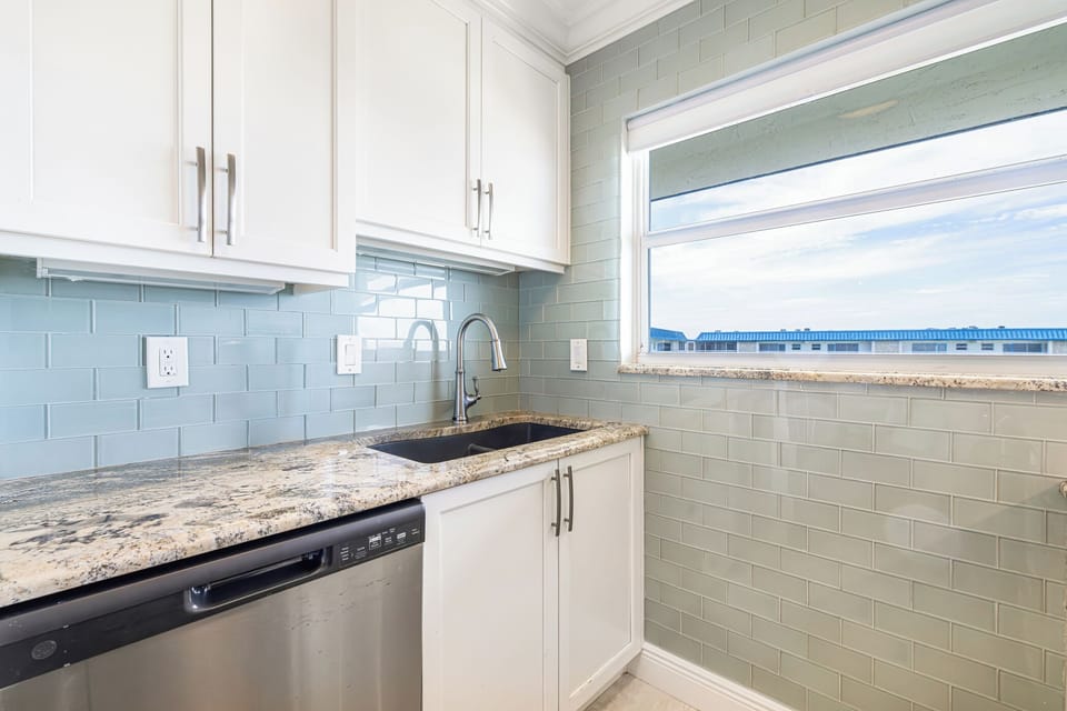 Granite countertops and coastal-inspired finishes throughout
