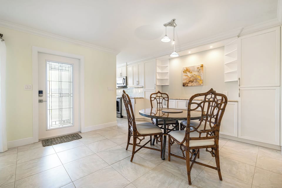 Open floor plan connecting the kitchen, dining, and living spaces
