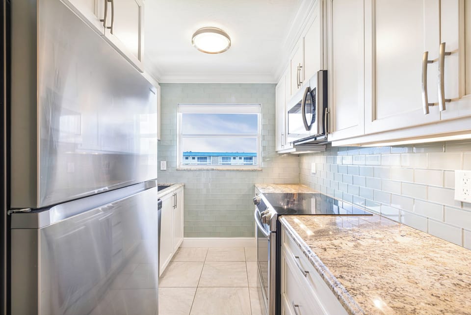 Updated kitchen with stainless appliances and Gulf views