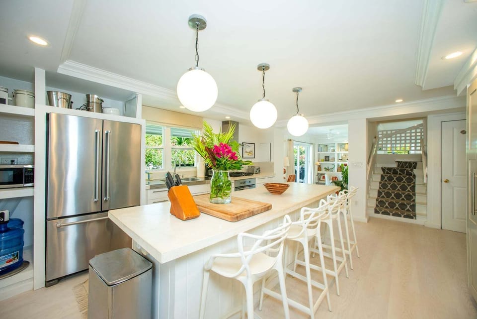 A large eight-foot island anchors the space, making it ideal for entertaining, cooking with family, or gathering while meals are prepared.