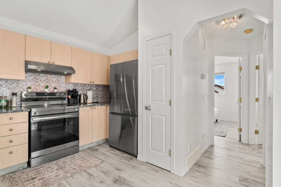 Fully equipped kitchen with stainless steel appliances and ample counter space