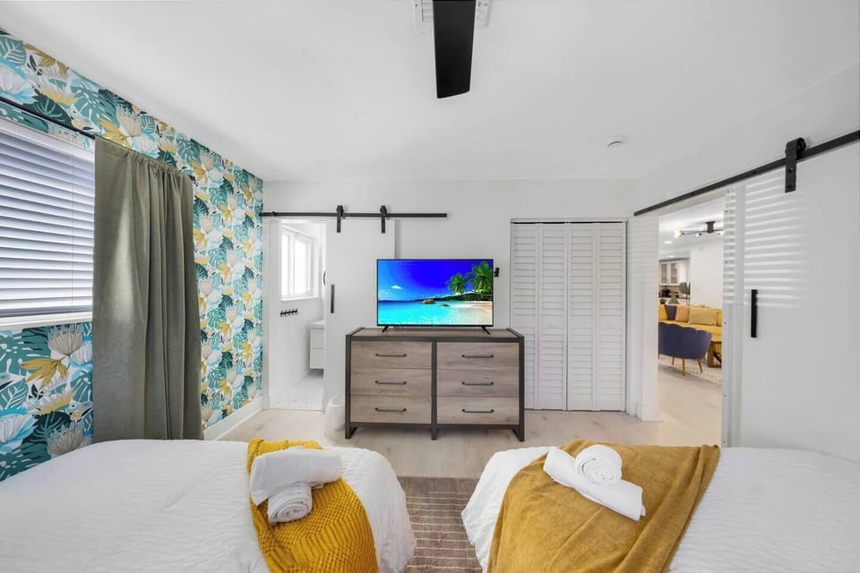 Two comfy beds and a big-screen TV for laid-back nights in.