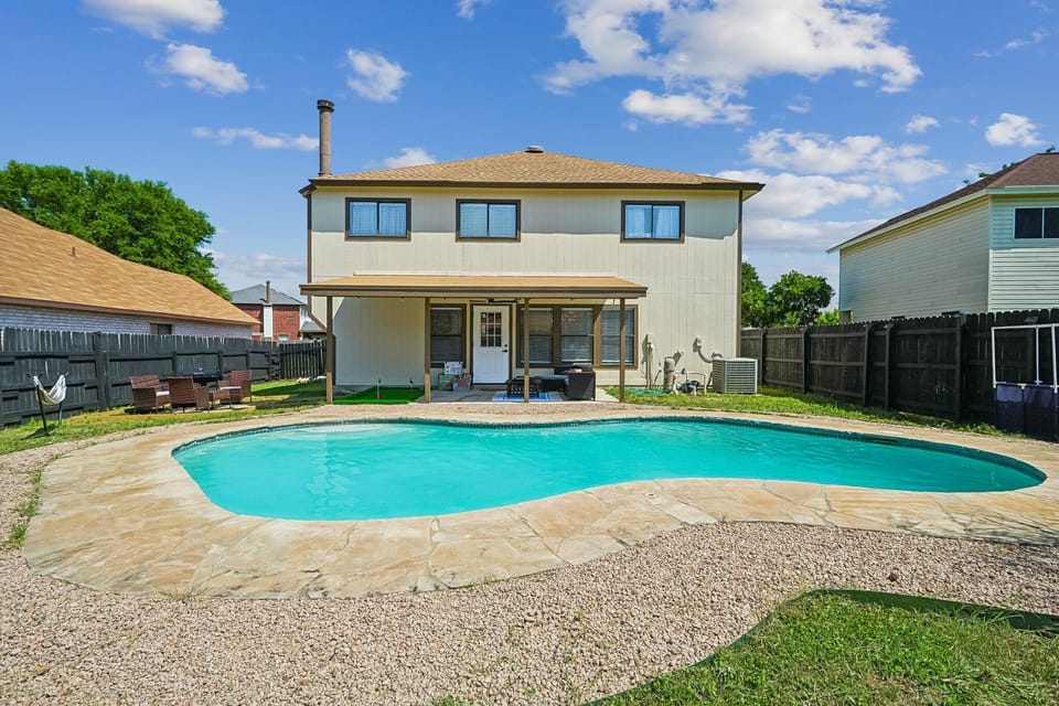 Private backyard pool with covered patio and plenty of space to unwind