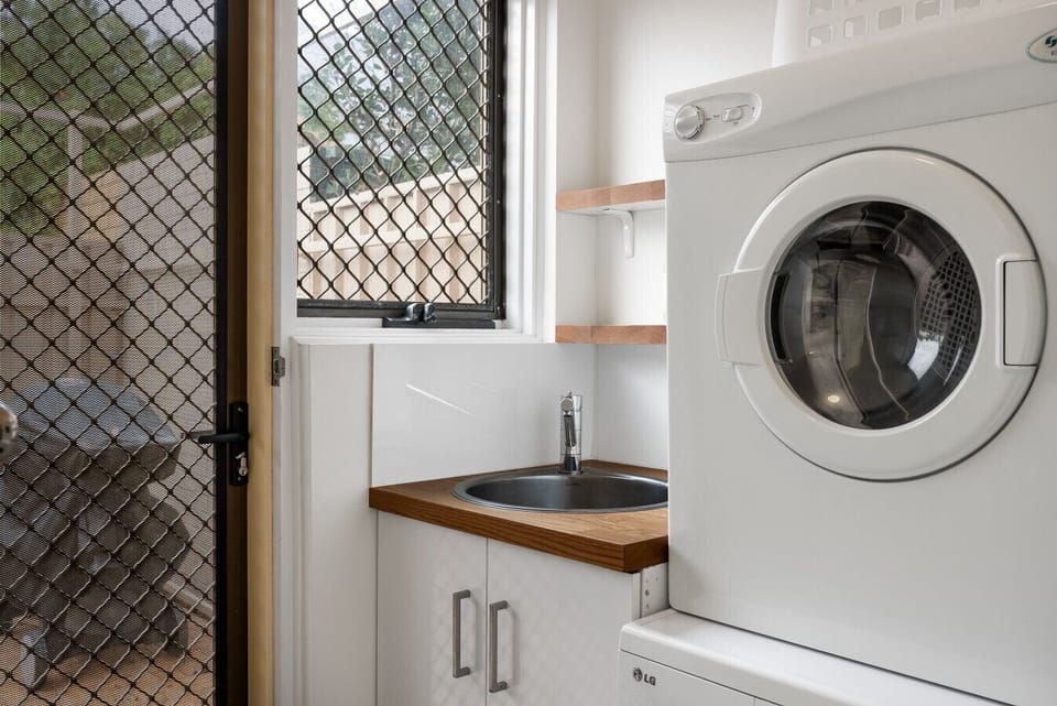 The separate laundry includes both a washer and dryer, making longer stays simple and convenient.