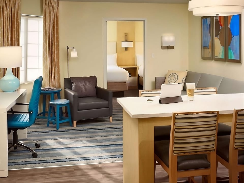 Unwind in a spacious suite with cozy seating and workspace.