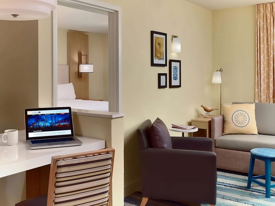 Settle in with a dedicated desk and relaxing lounge corner.