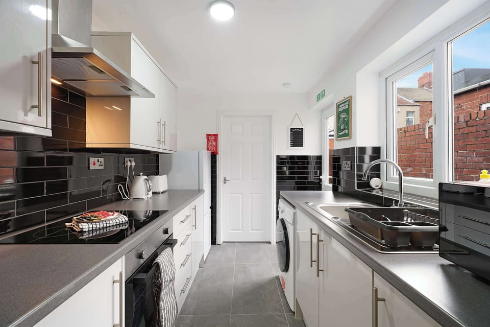 Fully equipped kitchen with an oven, hob, microwave, fridge, freezer, washing machine, kettle, toaster, and sink. Includes cookware, cutlery, glassware, mugs, and cleaning essentials, making self-catering simple and convenient.