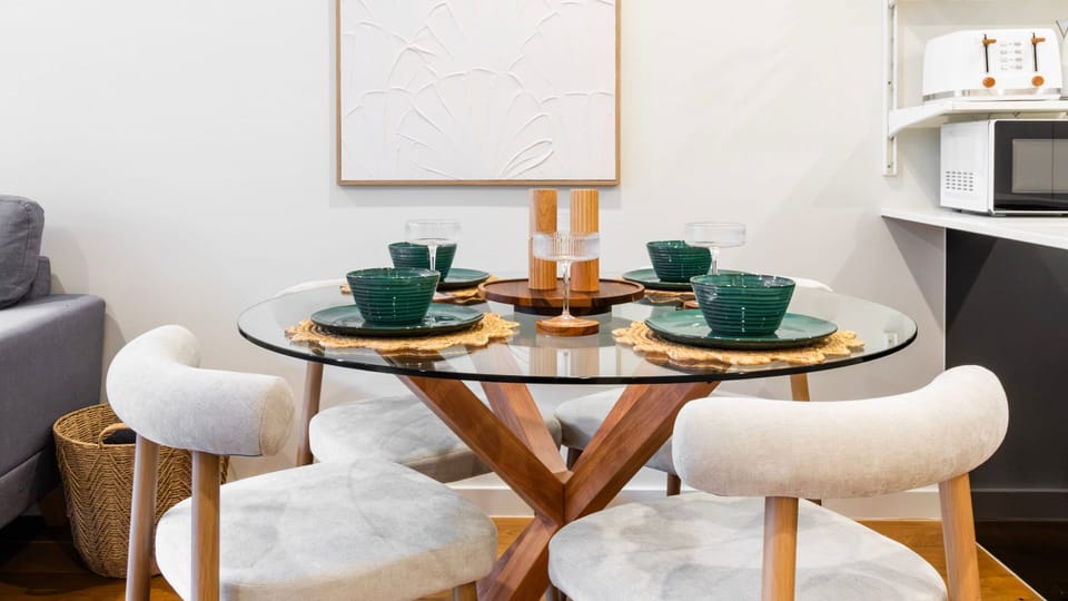 Gather around the dining table for intimate meals in a stylish setting.