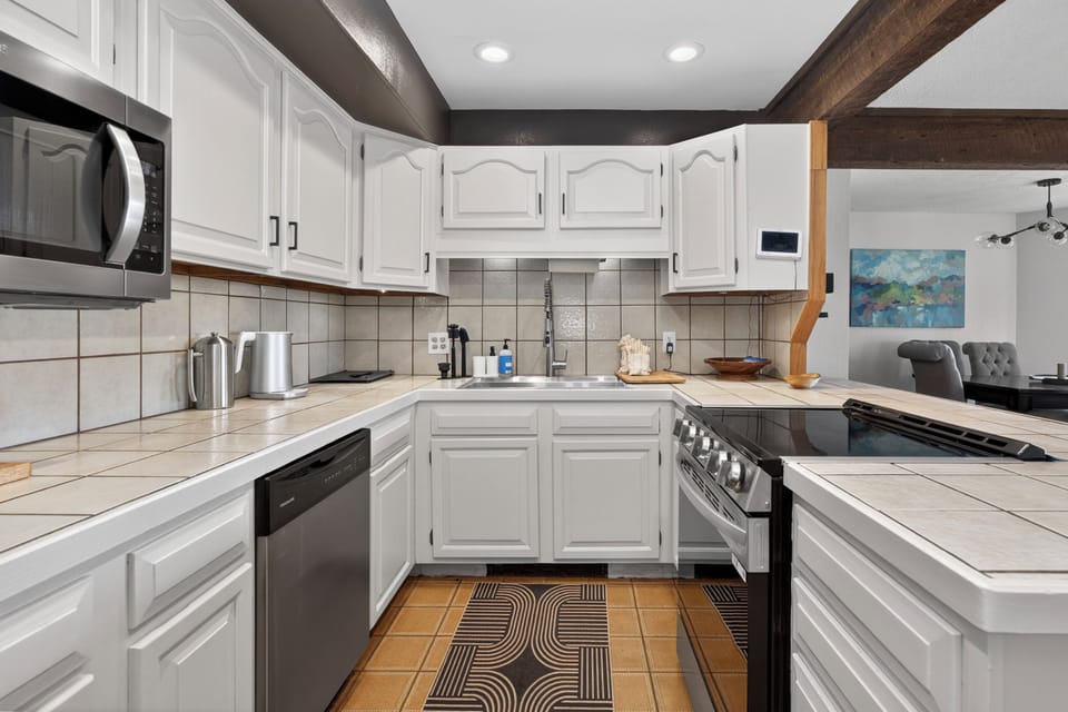 Your fully equipped kitchen invites culinary adventures with ample counter space, modern appliances, and stylish finishes—perfect for whipping up everything from quick breakfasts to gourmet dinners.