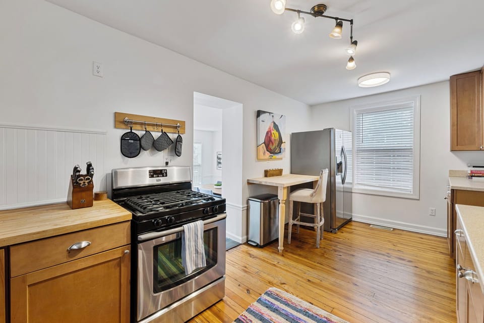 The kitchen features a gas stove and spacious refrigerator