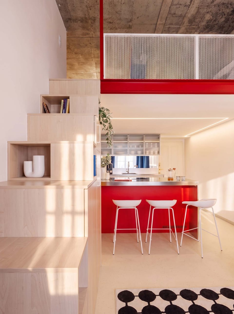 Kitchen with dinning seating and stairs to the upper level