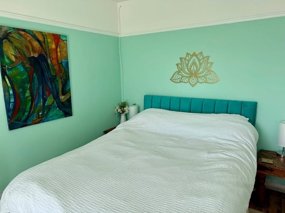 Kingsize bed with direct balcony access from this bedroom